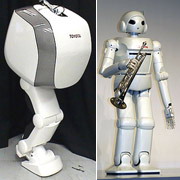 Слева — новая разработка японской компании, а справа —
робот-трубач, единственный на сегодняшний день человекоподобный робот Toyota,
для которого, видимо, нога и предназначена (фото Toyota).