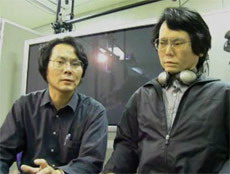 Исигуро (настоящий — слева) рассказывает о способностях и "устройстве" подопечного. Подопечный, судя по выражению лица, не соображает, о чём речь. Да он и не соображает вообще (фото с сайта pinktentacle.com).